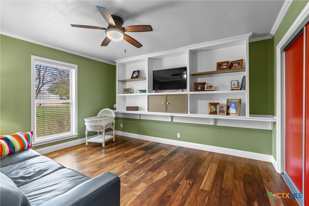 404 Skyline Road Georgetown, TX 78628 - Photo 22 of 40 a living room with furniture and a wooden floor