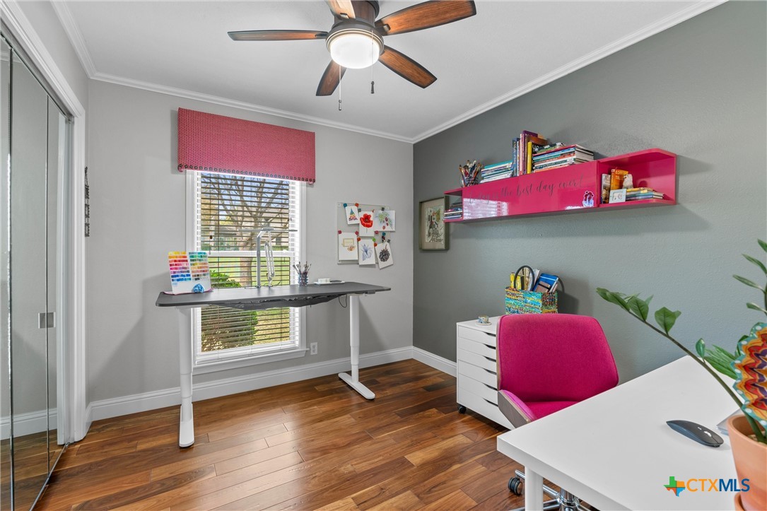 404 Skyline Road Georgetown, TX 78628 - Photo 23 of 40 a workspace with furniture wooden floor and window