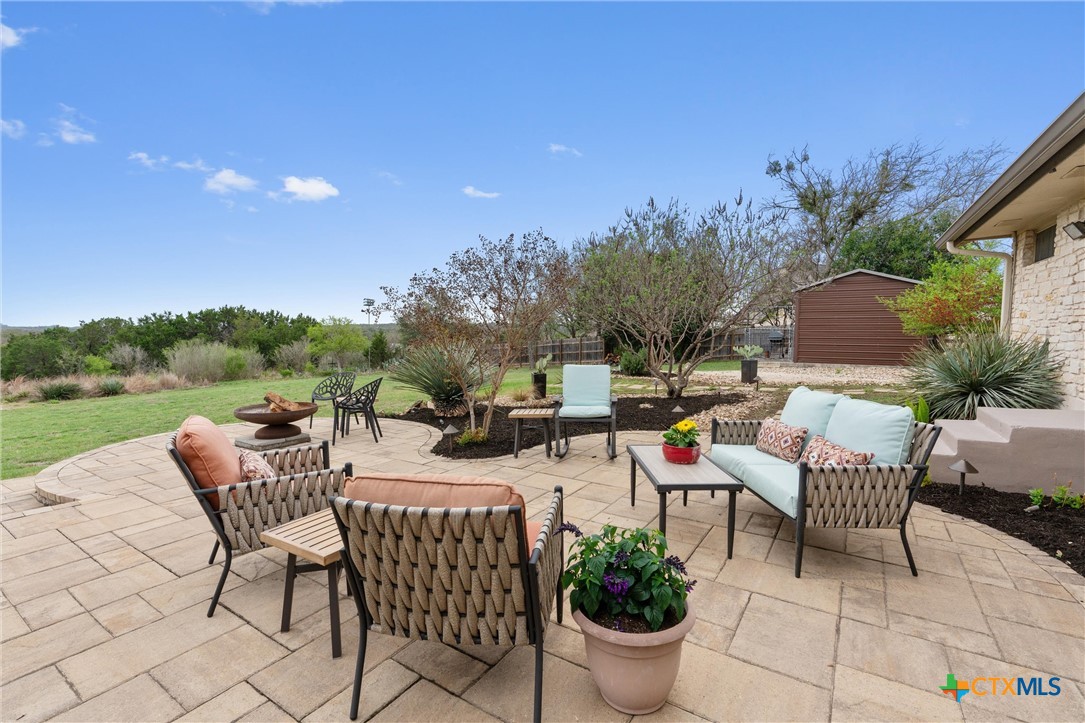 404 Skyline Road Georgetown, TX 78628 - Photo 27 of 40 a view of a patio with chairs and potted plants
