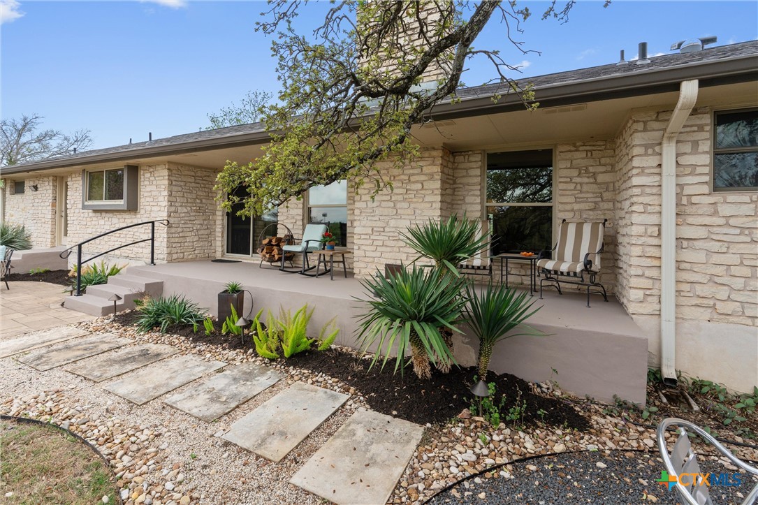 404 Skyline Road Georgetown, TX 78628 - Photo 28 of 40 a view of a patio with chairs and potted plants