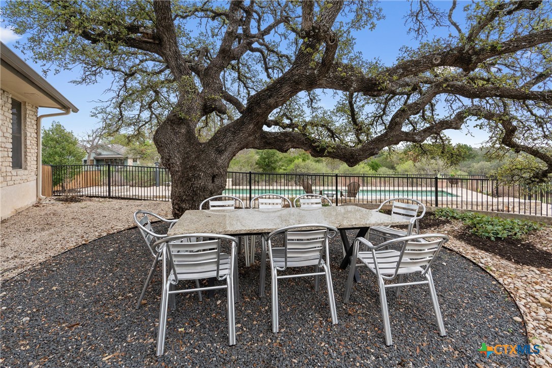 404 Skyline Road Georgetown, TX 78628 - Photo 29 of 40 a patio with table and chairs