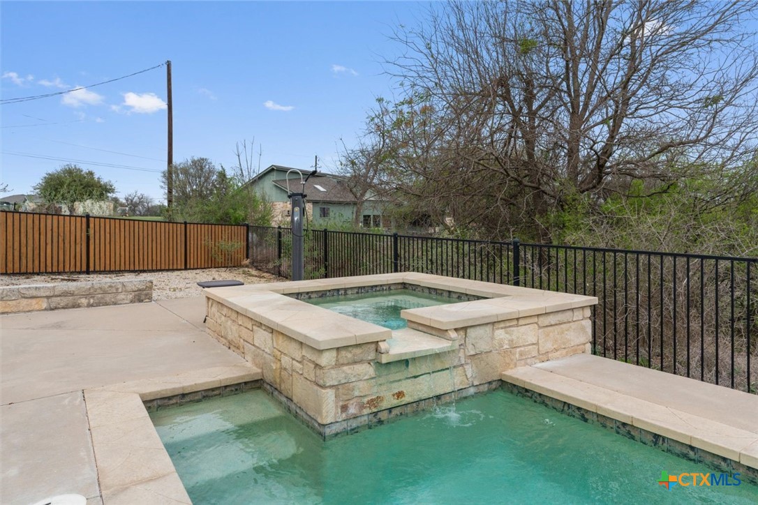 404 Skyline Road Georgetown, TX 78628 - Photo 32 of 40 a view of a backyard with a patio