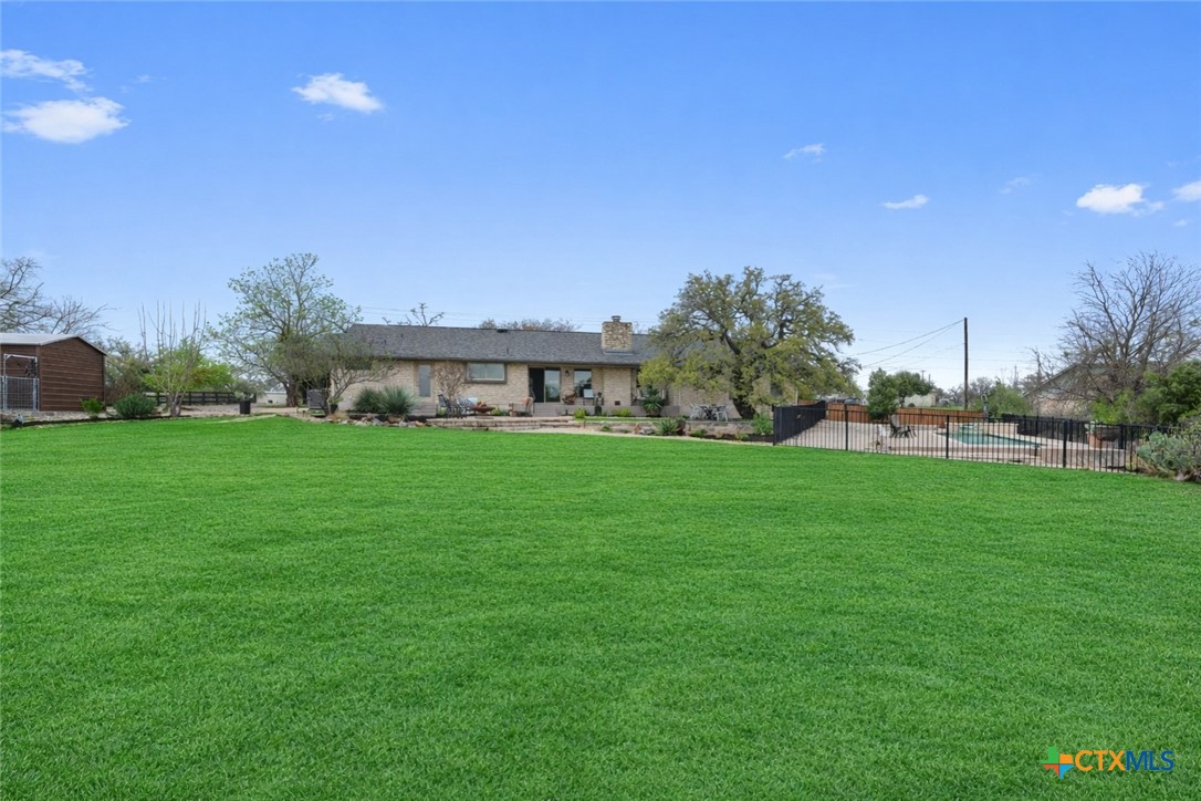 404 Skyline Road Georgetown, TX 78628 - Photo 34 of 40 a view of house with garden space and trees