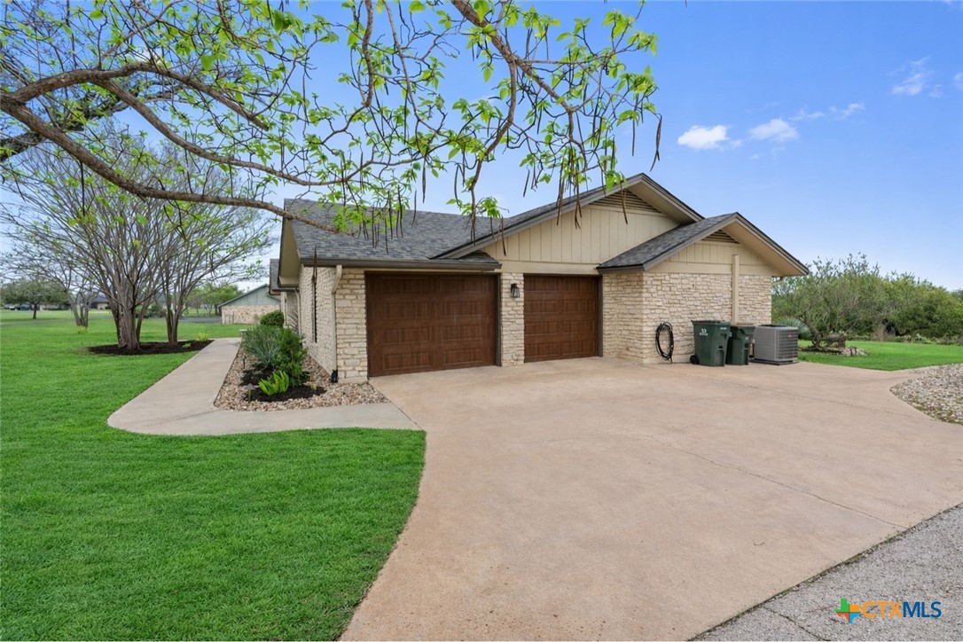 404 Skyline Road Georgetown, TX 78628 - Photo 37 of 40 a front view of a house with a yard and garage