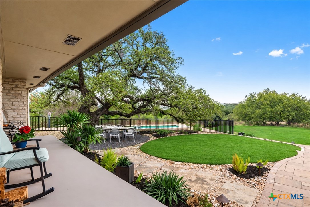 404 Skyline Road Georgetown, TX 78628 - Photo 6 of 40 a view of a garden with plants and large trees