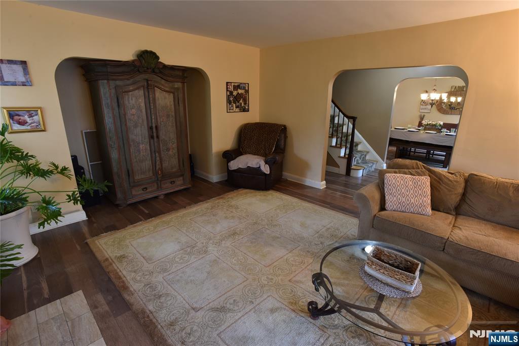 585 Monroe Place Ridgefield, NJ 07657 - Photo 5 of 28 a living room with furniture and a mirror