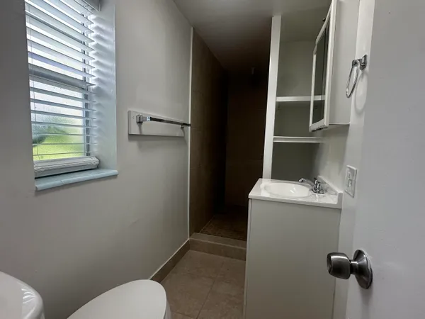 a bathroom with a toilet and a sink