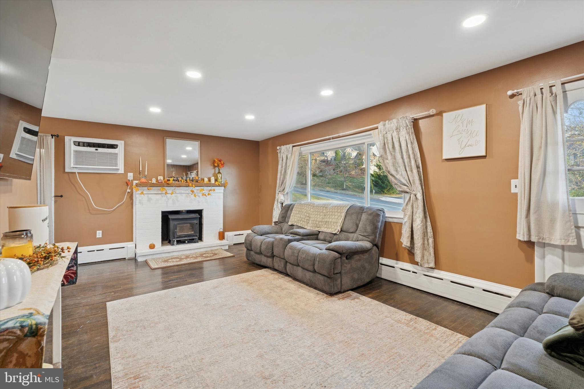1629 Rupert Road Pottstown, PA 19464 - Photo 6 of 28 a living room with furniture a fireplace and a flat screen tv