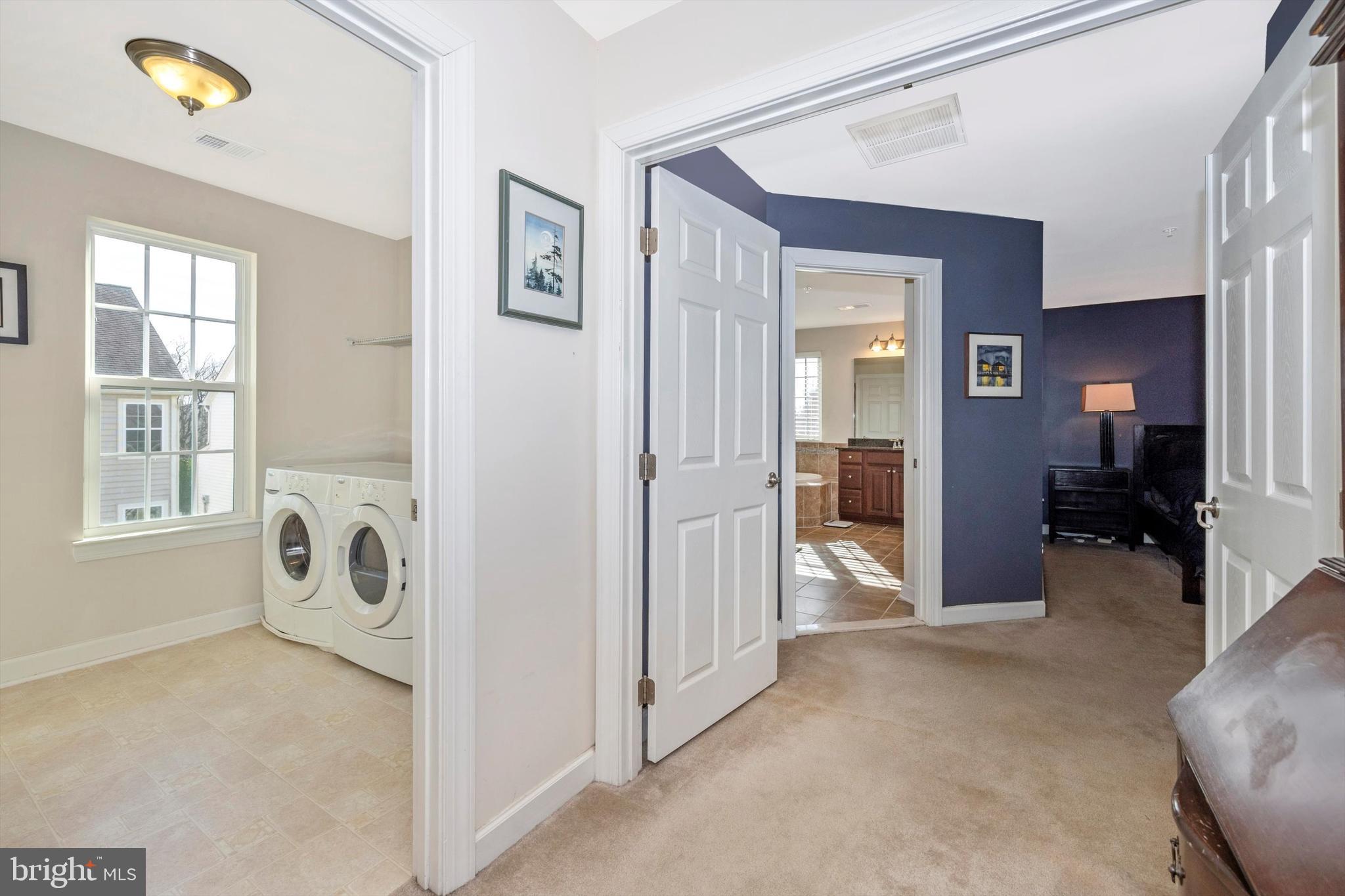 9121 Bealls Farm Road Frederick, MD 21704 - Photo 24 of 63 a view of a hallway with bathroom and a livingroom