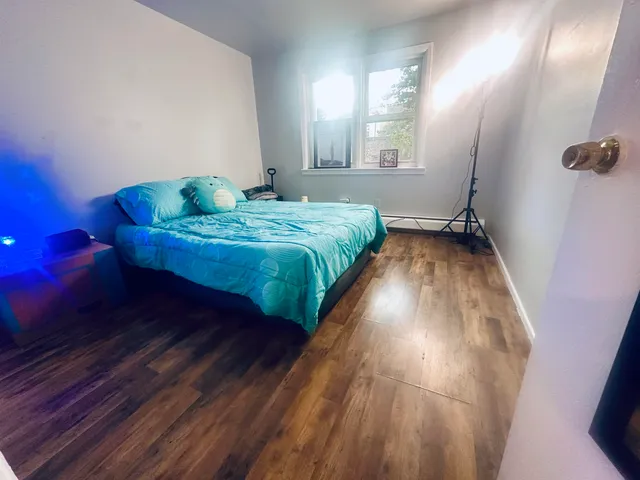 a bedroom with a bed and window