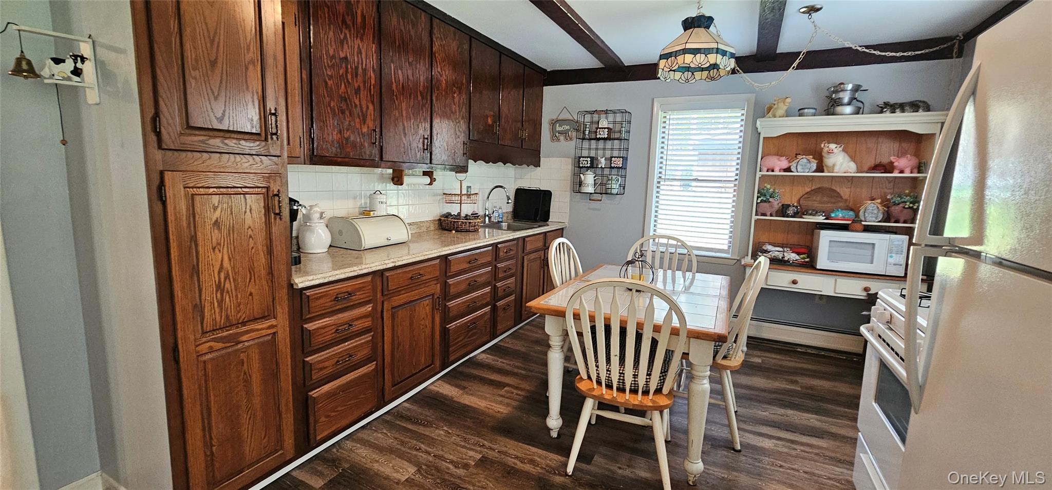 87 Parker Road Narrowsburg, NY 12764 - Photo 12 of 23 a kitchen with stainless steel appliances kitchen island granite countertop a refrigerator a stove a sink and a dining table with garden view