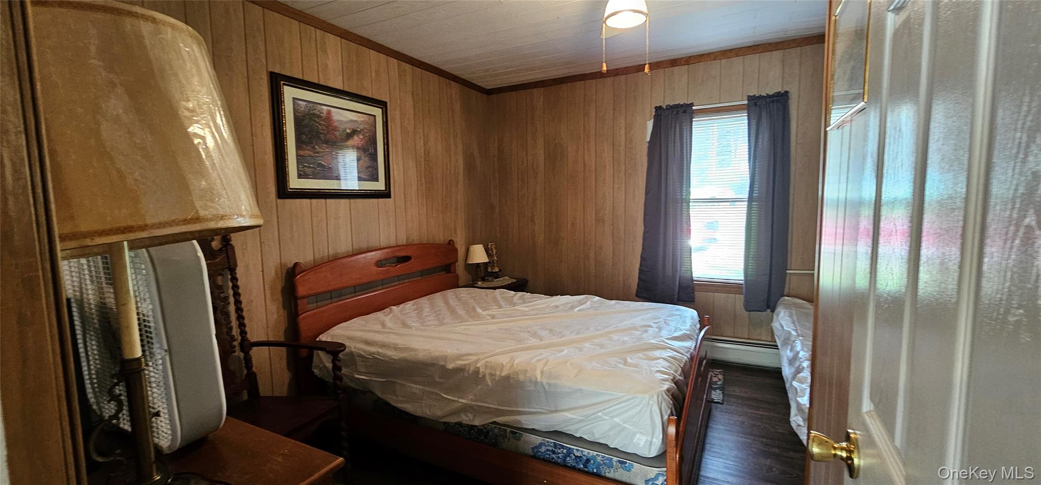 87 Parker Road Narrowsburg, NY 12764 - Photo 14 of 23 a bedroom with a bed and a mirror