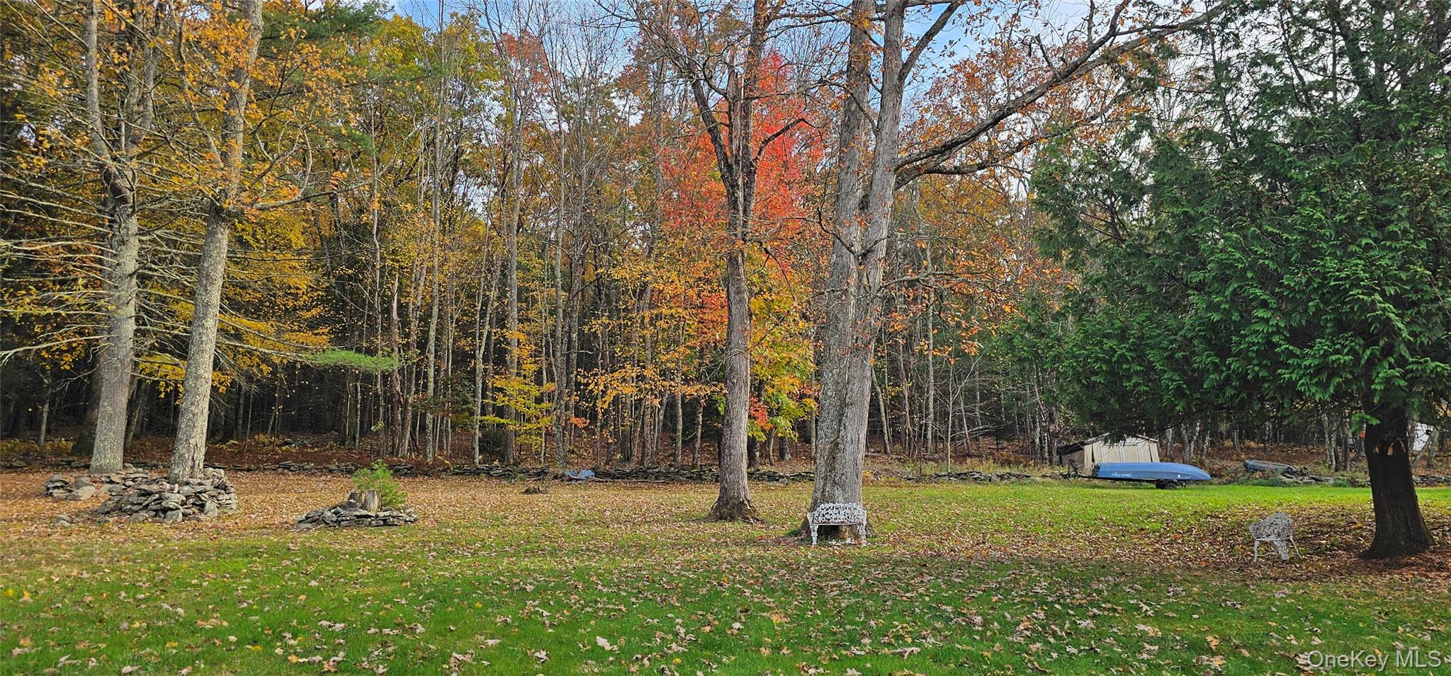 87 Parker Road Narrowsburg, NY 12764 - Photo 21 of 23 a backyard of a house with lots of green space and fountain