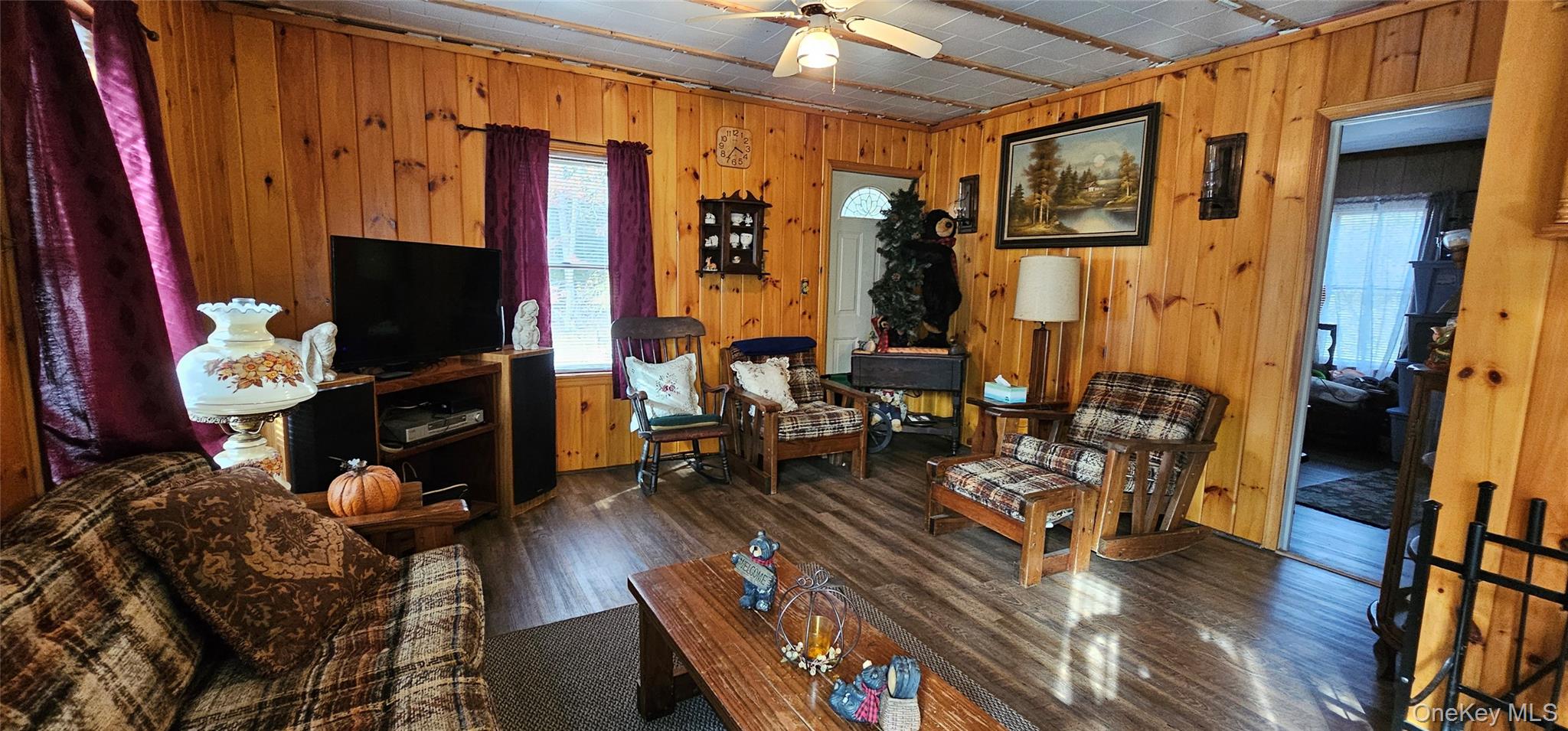 87 Parker Road Narrowsburg, NY 12764 - Photo 6 of 23 a living room with furniture a flat screen tv and a fireplace