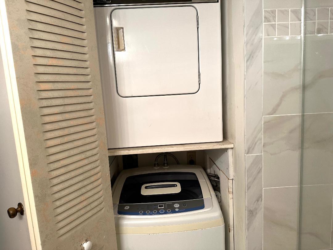 8305 Casa Del Lago, Unit E Boca Raton, FL 33433 - Photo 11 of 16 a utility room with dryer and washer