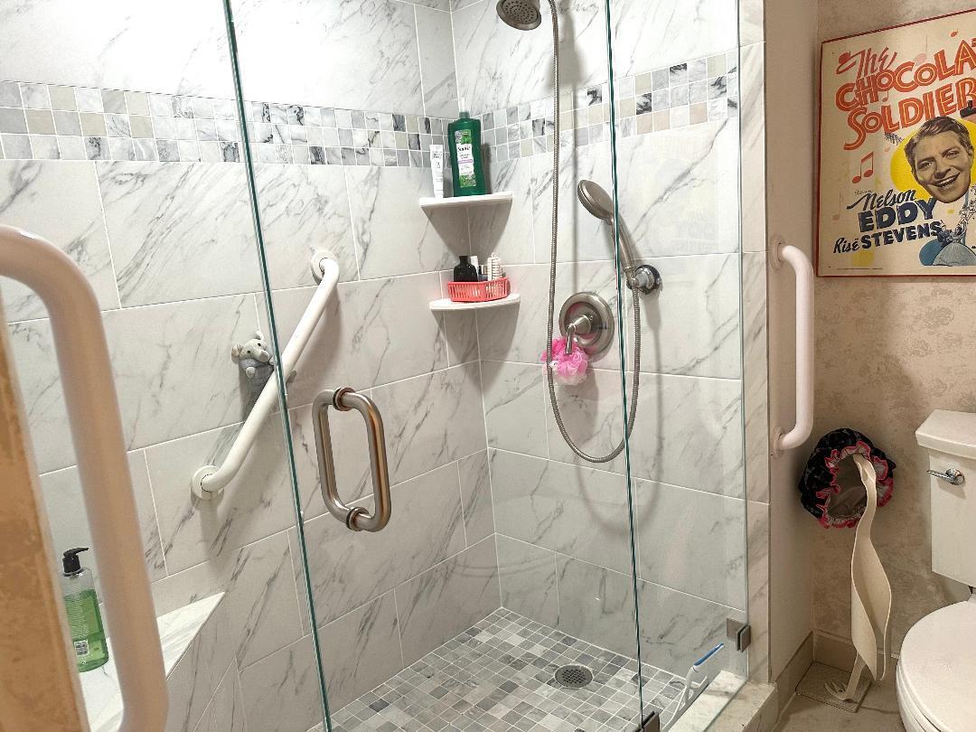 8305 Casa Del Lago, Unit E Boca Raton, FL 33433 - Photo 8 of 16 a bathroom with a shower