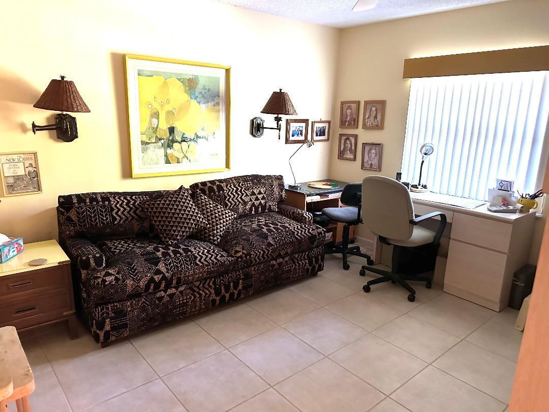 8305 Casa Del Lago, Unit E Boca Raton, FL 33433 - Photo 9 of 16 a living room with furniture and a window