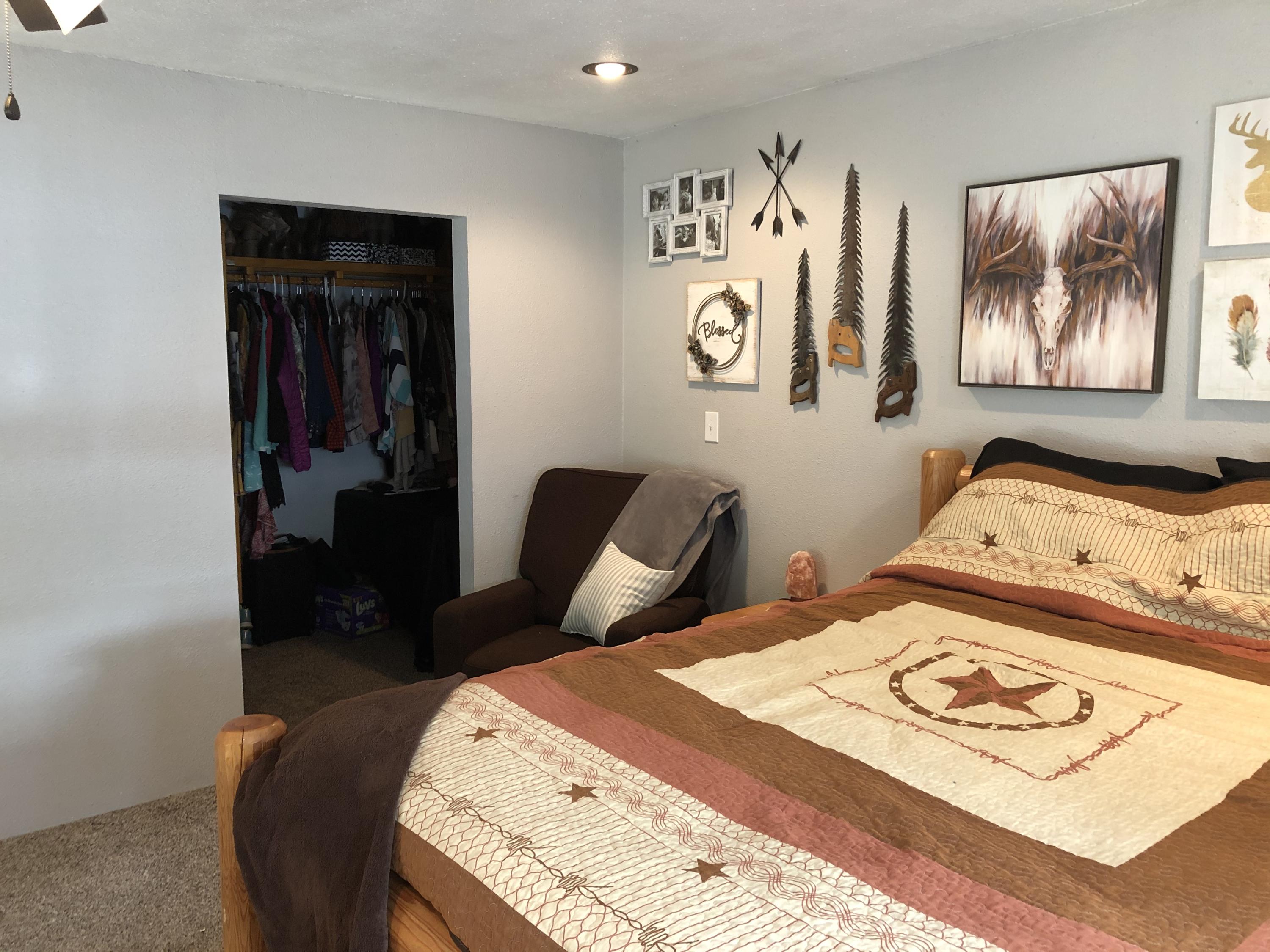 441 Upper Applegate Road Jacksonville, OR 97530 - Photo 13 of 25 a bedroom with a bed and painting on the wall