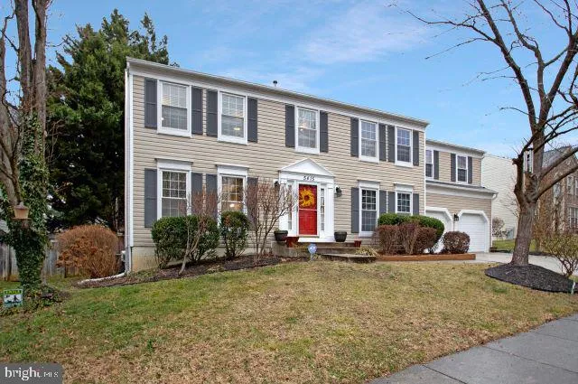 a front view of a house with many windows