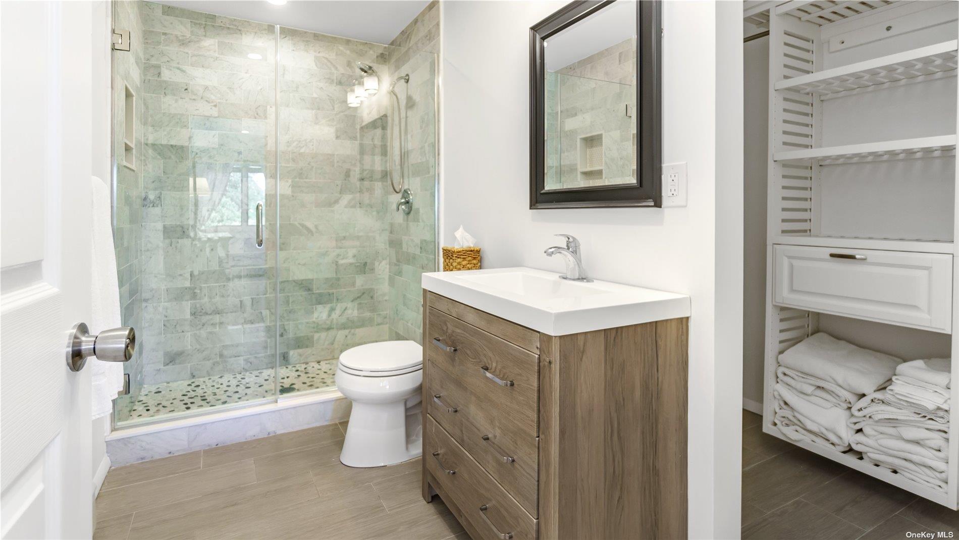 19 Rogers Lane Remsenburg, NY 11960 - Photo 14 of 28 a bathroom with a sink toilet and shower