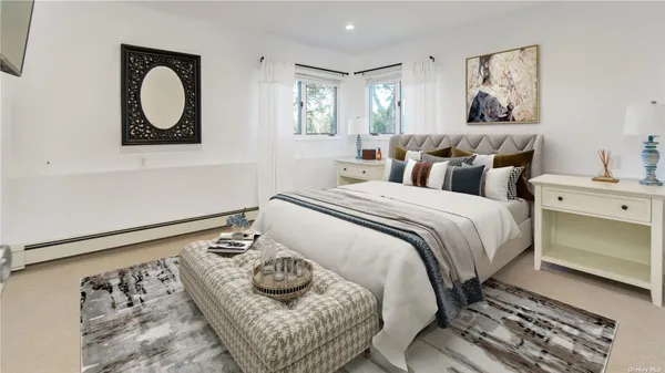 a bedroom with a bed and a painting on the wall