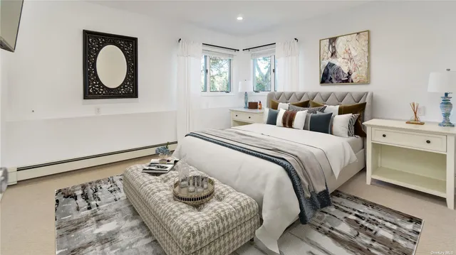 a bedroom with a bed and a painting on the wall