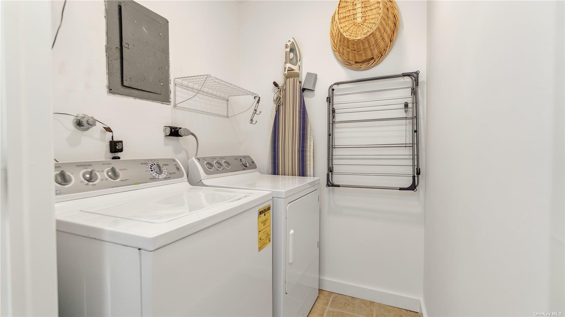 19 Rogers Lane Remsenburg, NY 11960 - Photo 20 of 28 a utility room with dryer and washer