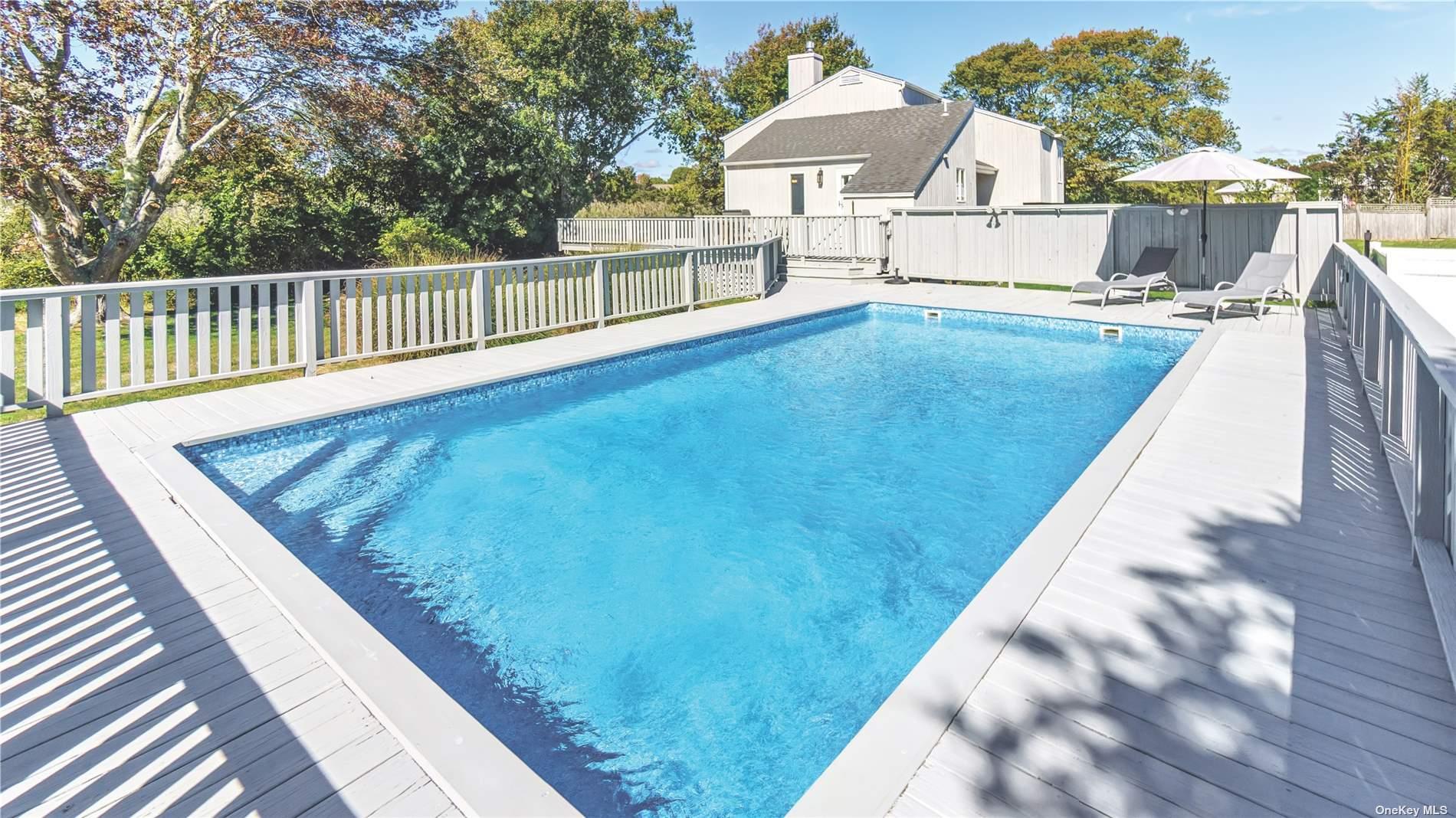 19 Rogers Lane Remsenburg, NY 11960 - Photo 22 of 28 a view of balcony with two chairs and wooden floor