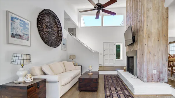a living room with furniture and a rug
