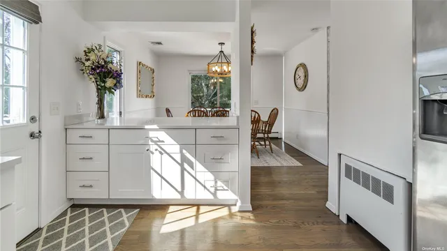 a view of a living room and dining room