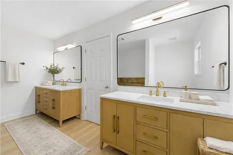 a bathroom with a tub and toilet