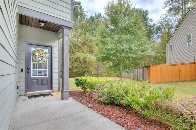 a view of a backyard with plants