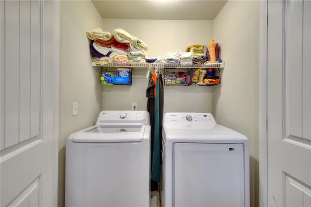 a utility room with dryer and washer