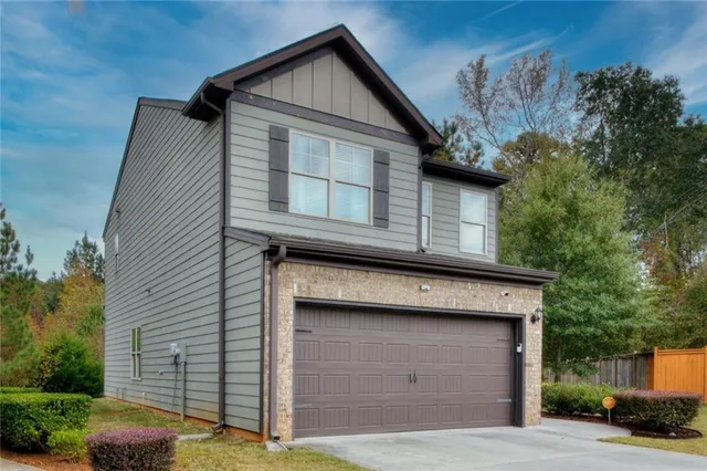 a front view of a house with a garage