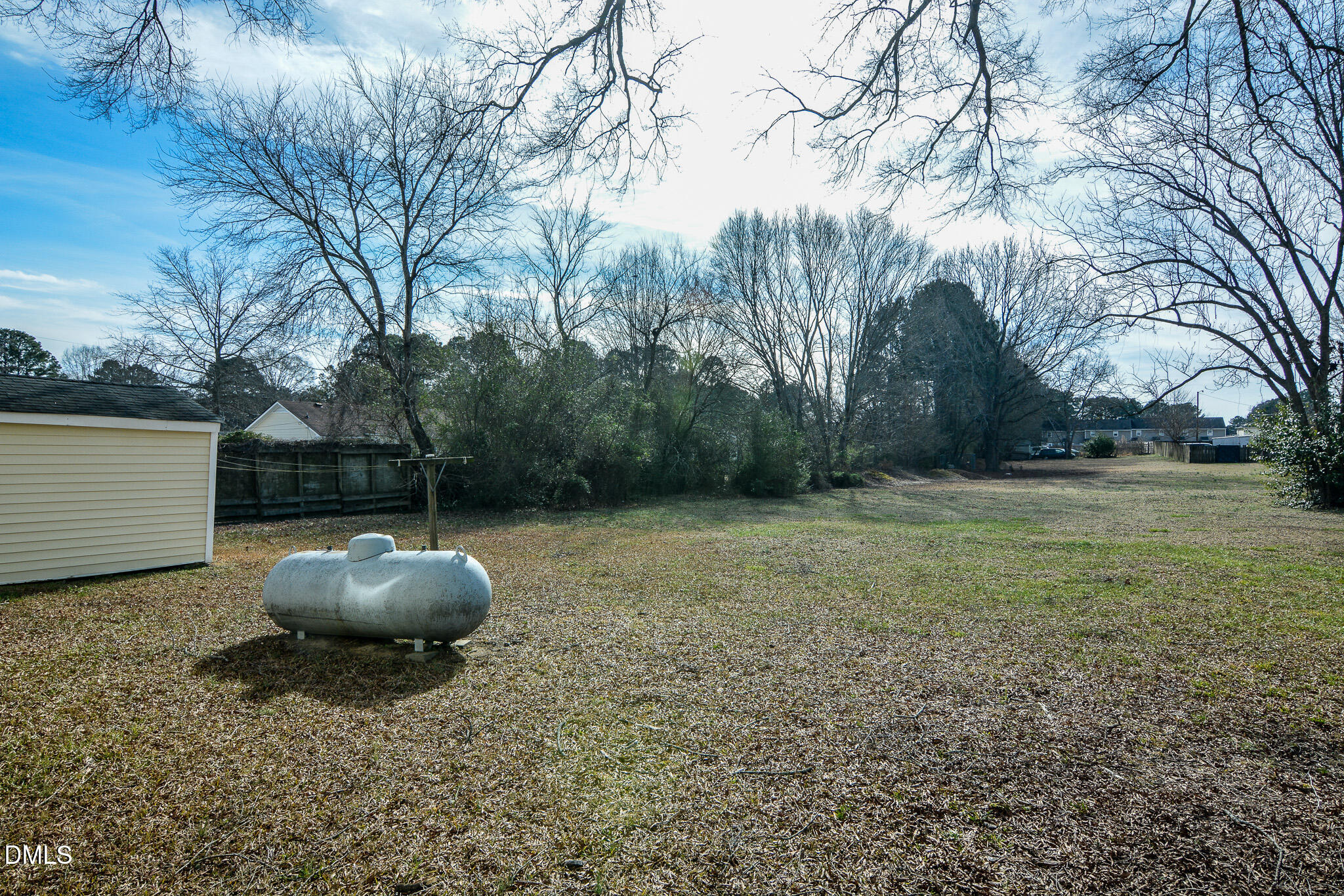 543 West 2nd Street Clayton, NC 27520 - Photo 12 of 13 a backyard of a house with lots of green space