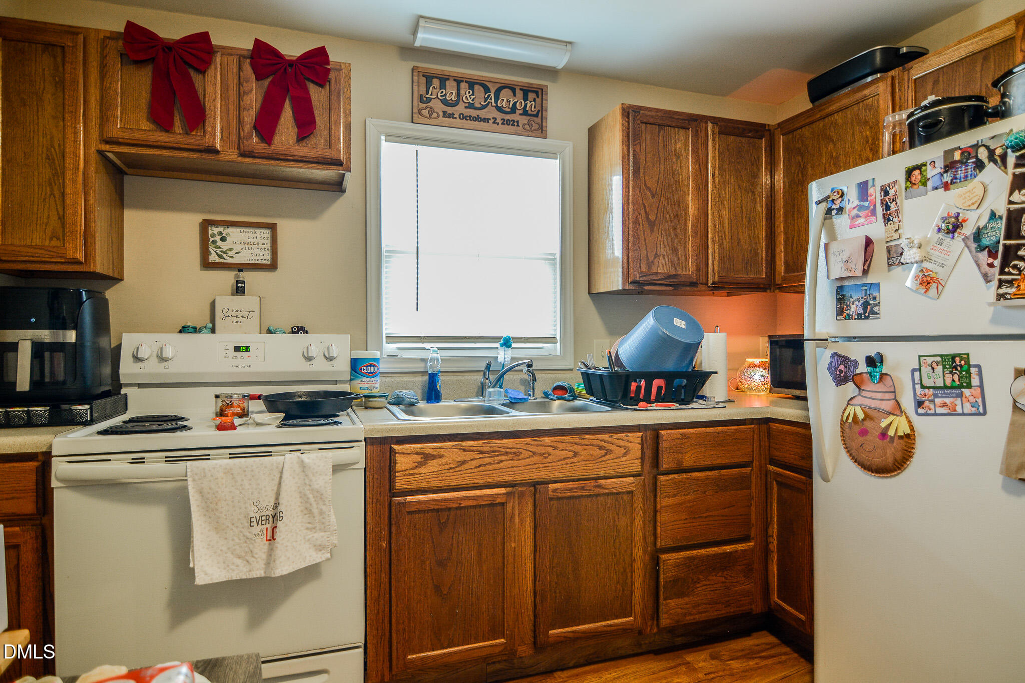 543 West 2nd Street Clayton, NC 27520 - Photo 4 of 13 a kitchen with stainless steel appliances granite countertop a sink and cabinets