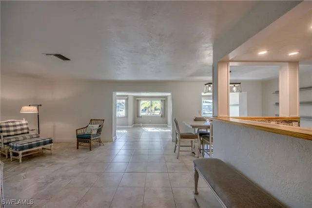 a living room with furniture and a table