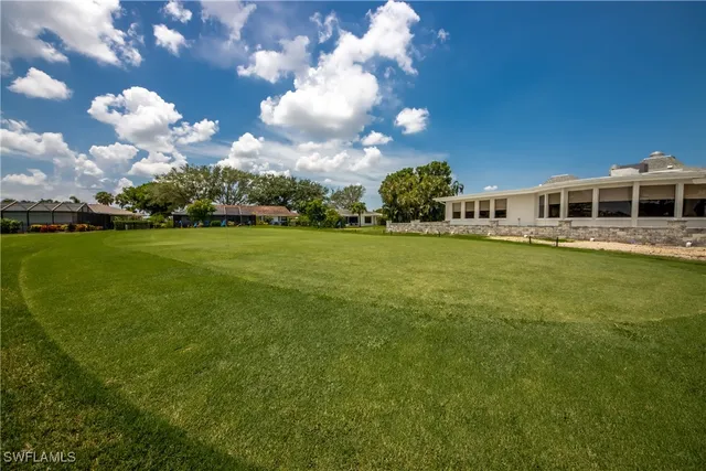 a view of a house with a big yard