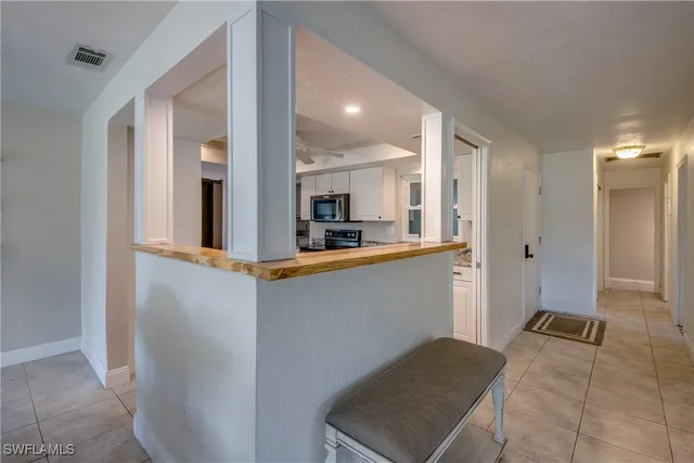 a view of a kitchen from the hallway