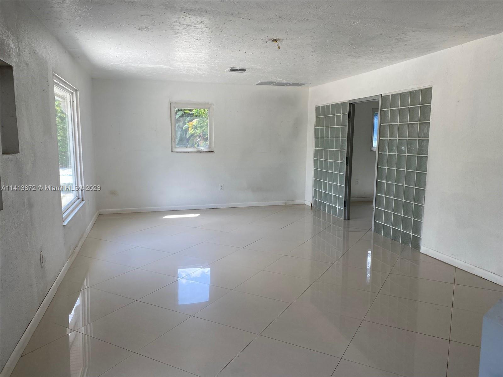 3141 C Road Loxahatchee, FL 33470 - Photo 15 of 16 an empty room with windows