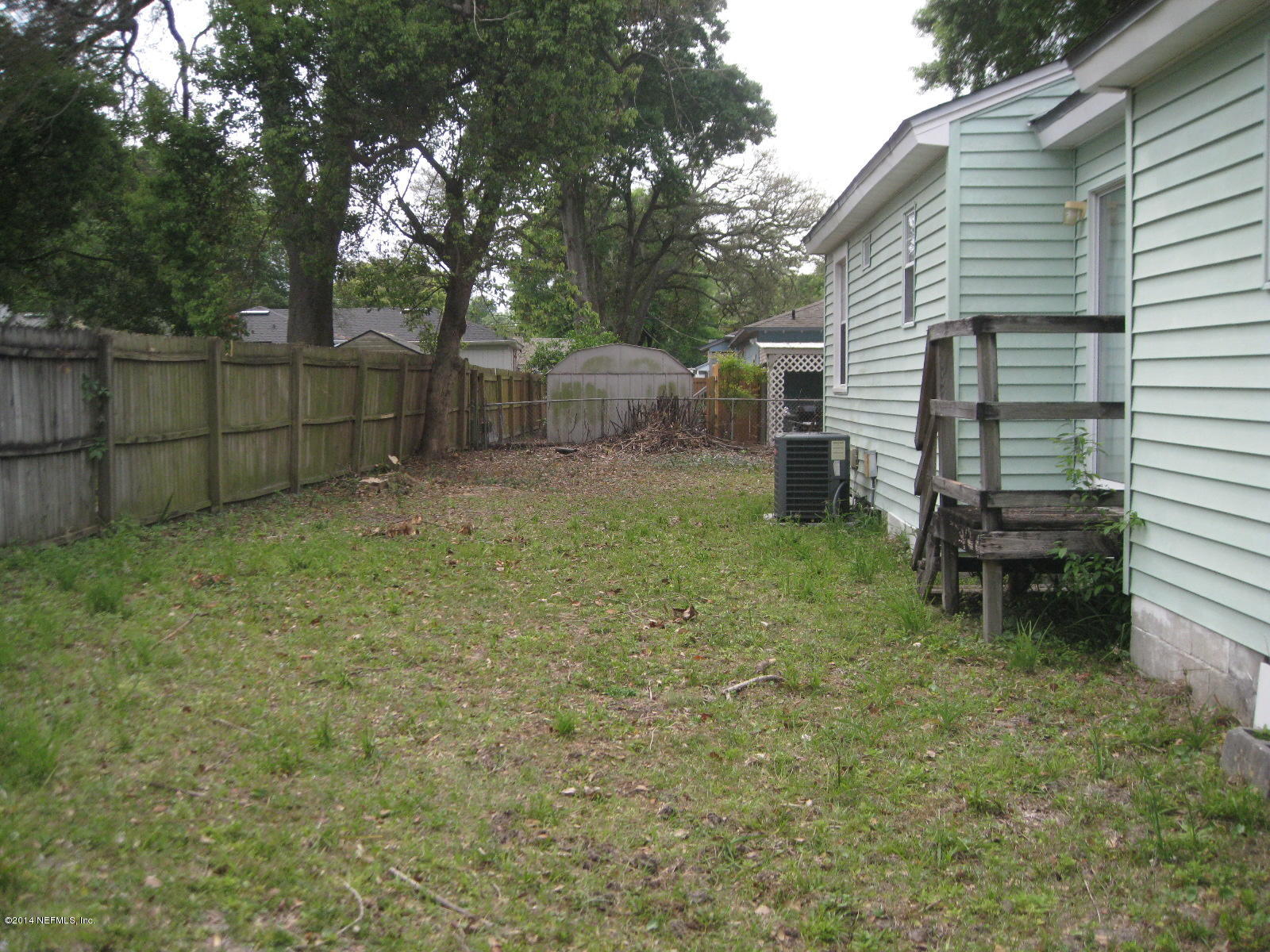 3762 Lilly Road North Jacksonville, FL 32207 - Photo 3 of 16 a backyard of a house with oven and garden