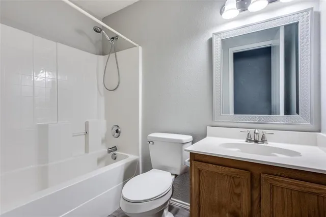 a bathroom with a sink a toilet and a bathtub