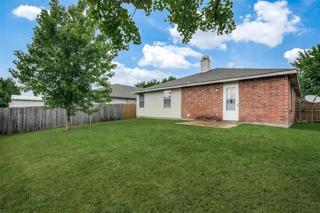 a backyard of a house with lots of green space