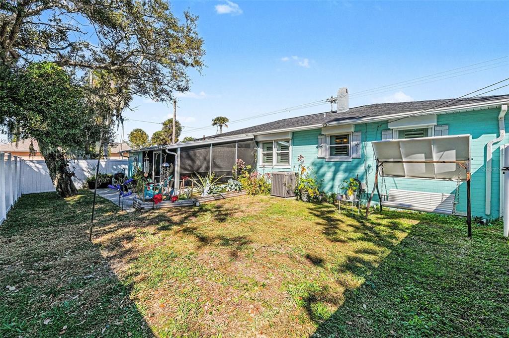 302 Riverside Drive Daytona Beach, FL 32117 - Photo 19 of 22 a view of a house with backyard and sitting area