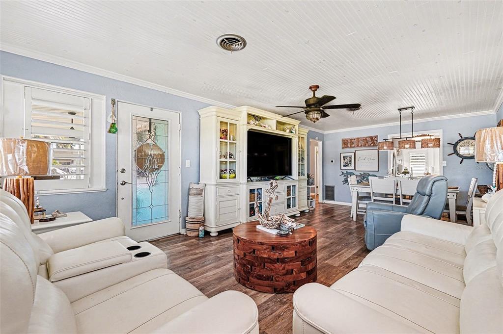 302 Riverside Drive Daytona Beach, FL 32117 - Photo 4 of 22 a living room with furniture and a flat screen tv