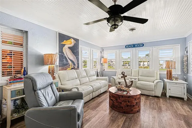 a living room with furniture or couch and a chandelier