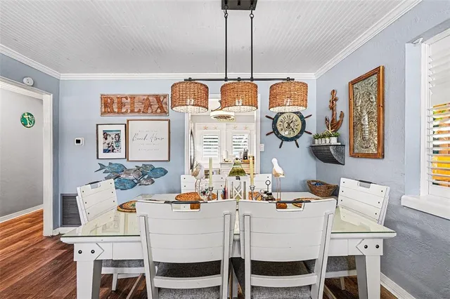 a dining room with furniture and window