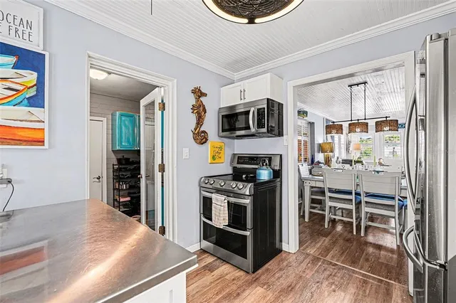 a kitchen with a stove and a refrigerator