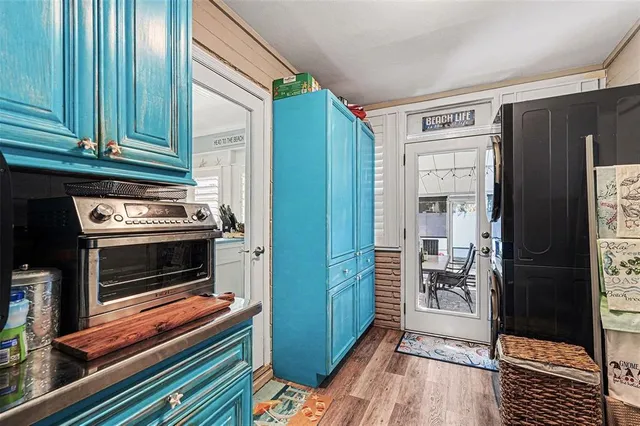 a kitchen with cabinets and a stove