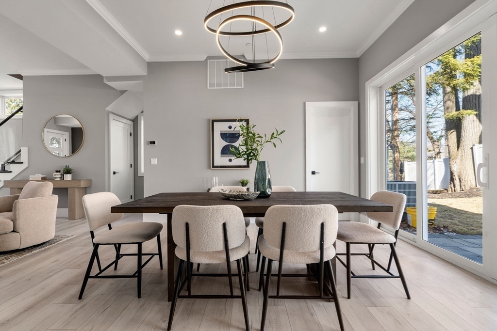 28 Wilson Circle, Unit 28 Newton, MA 02461 - Photo 5 of 14 a view of a dining room with furniture window and wooden floor
